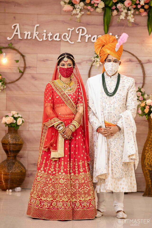 Indian Couples wearing coordinated face masks with outfits
