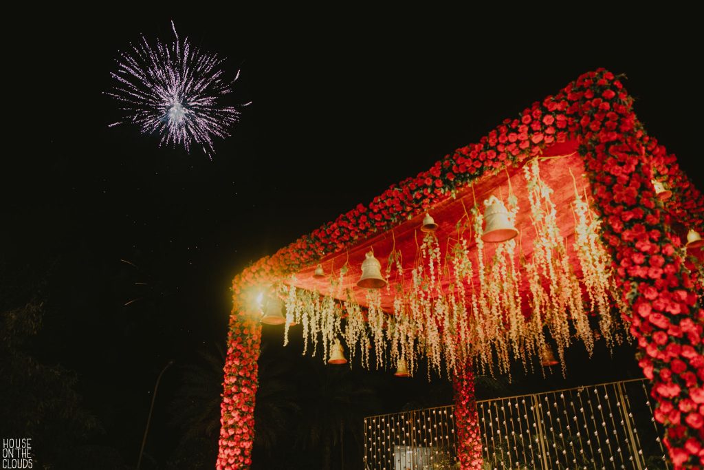 red rose open floral mandap with hanging flowers