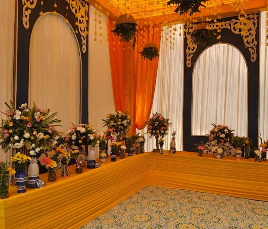 bunch floral decoration and vases with drapes for haldi decoration of neha kakkar 