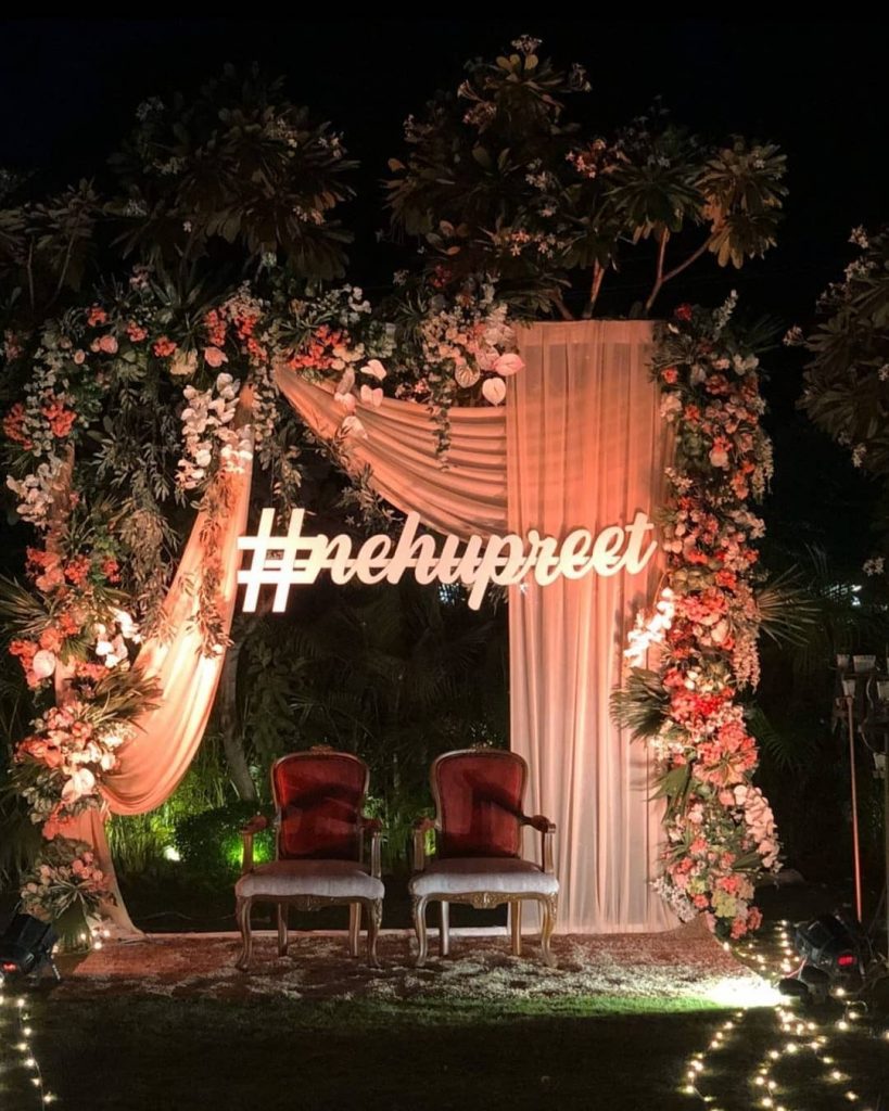 Floral reception decor from neha kakkar wedding with their wedding hashtag #nehupreet