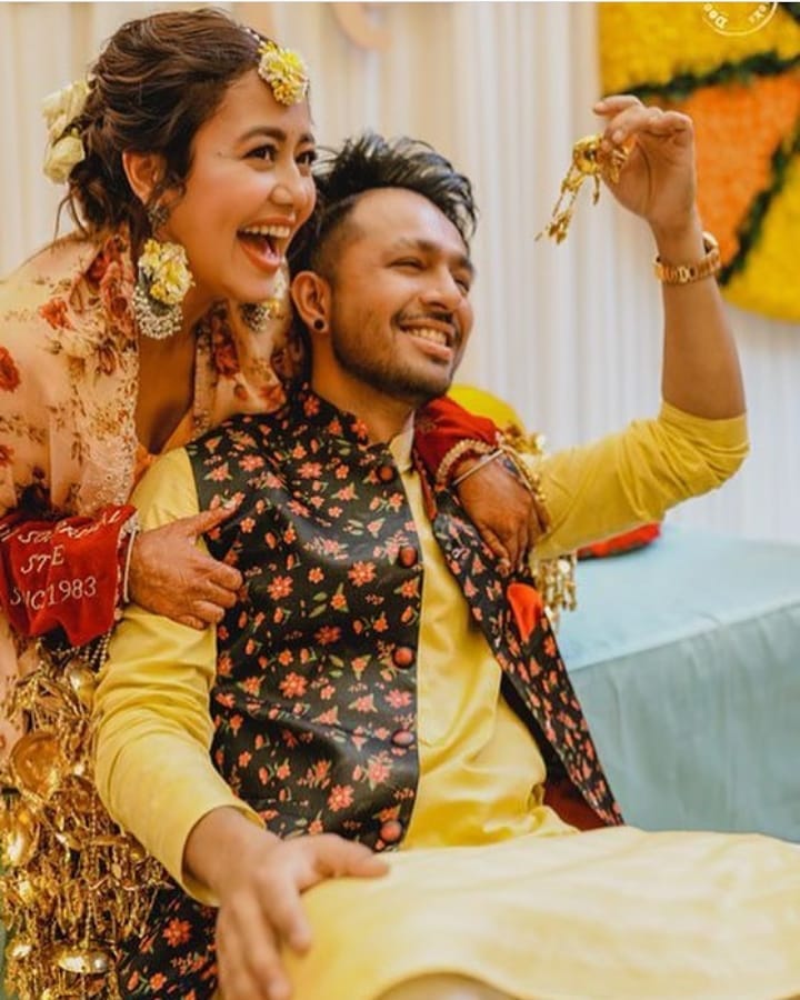 tony and neha kakkar posing during haldi function 