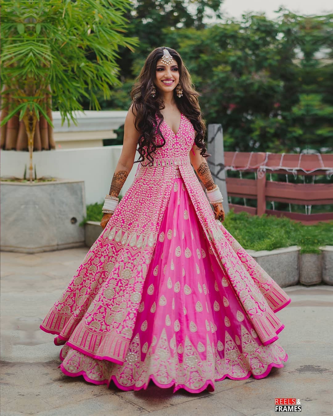 pink front slit embroidered mehndi dress code | WedAbout