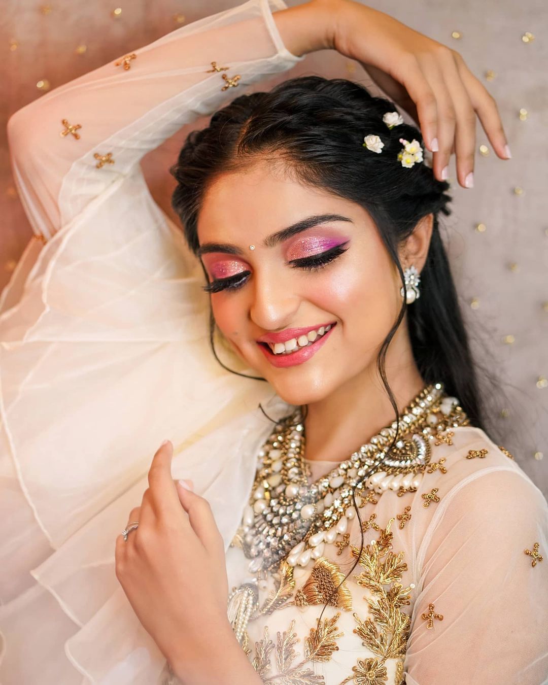The Bride Donned A Rose Pink 'Lehenga' With Open Hairstyle For Her Day  Wedding