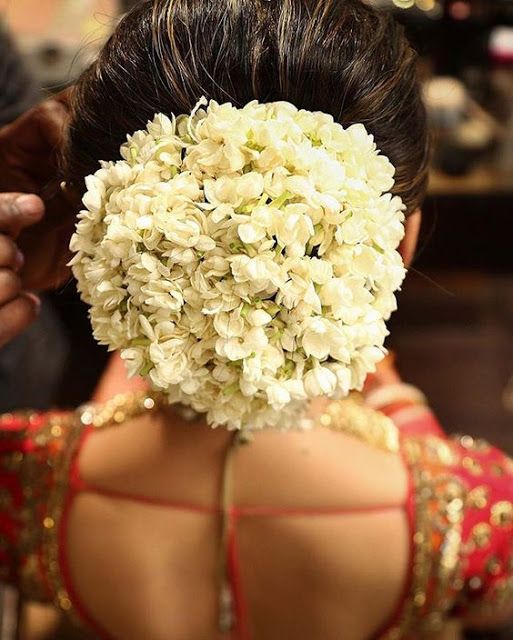 bridal hairstyle for round face with jasmine flowers