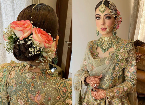 punjabi bride in a low bun adorned with flowers