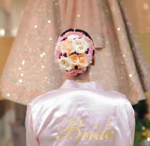bridal bun with pastel flowers
