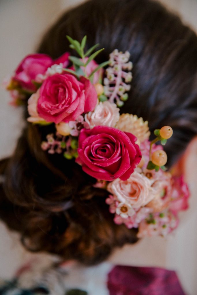 bride in a bridal bun with flowers