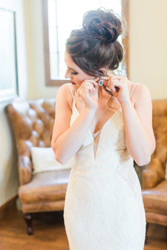 bride in high bun hairstyle for her wedding