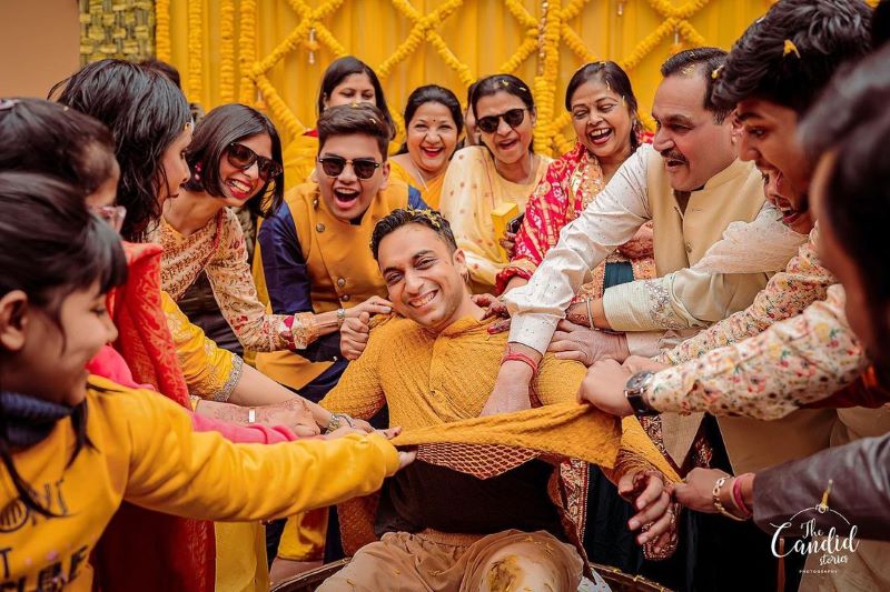 Haldi photoshoot poses for groom with family
