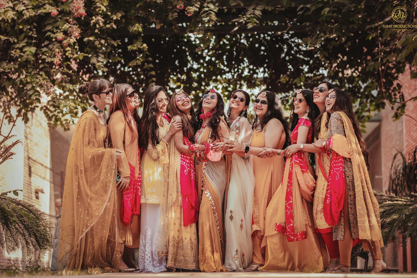 Crazy company of bridesmaids holding bride in red dress in the park at  bachelorette party. 7219498 Stock Photo at Vecteezy