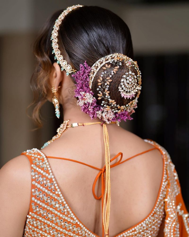 best and latest embellished bun indian reception bridal hairstyle 1