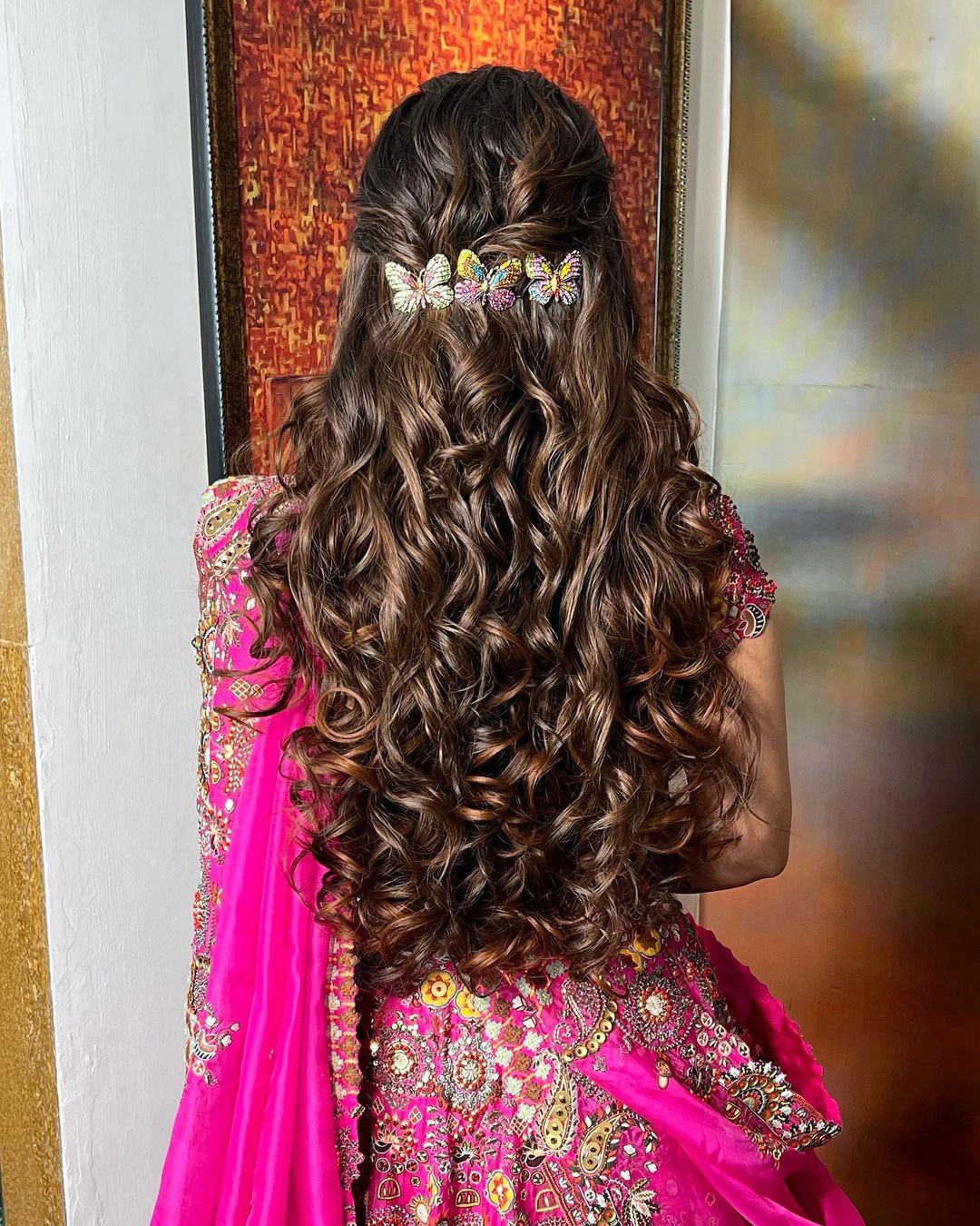 latest indian reception bridal hairstyle with butterfly accessory 1