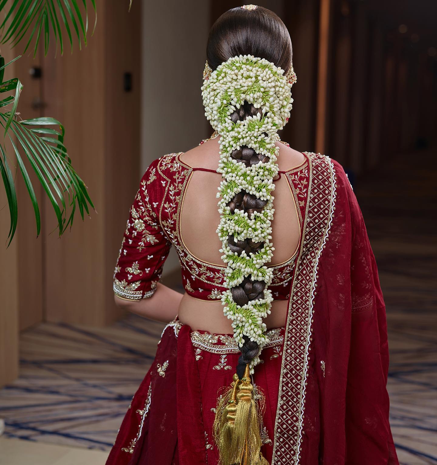 traditional south indian bridal hairstyle with gajra flowers