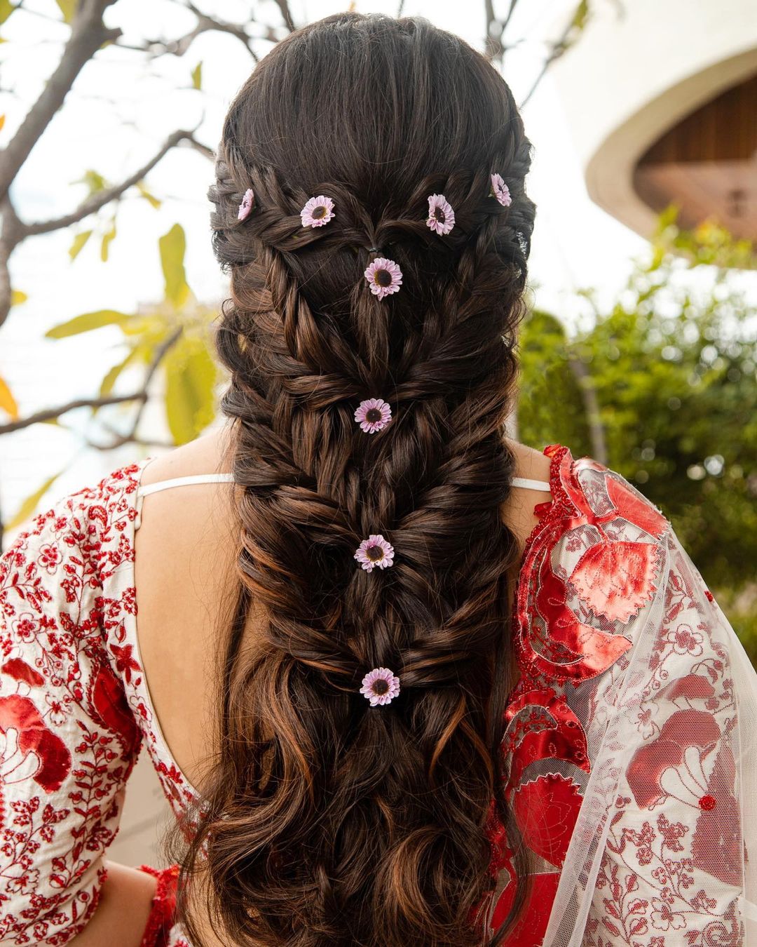 unique and quirky indian reception bridal hairstyle with braid