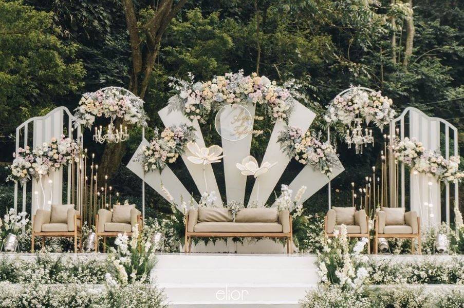 simple stage decoration idea for outdoor with white flowers