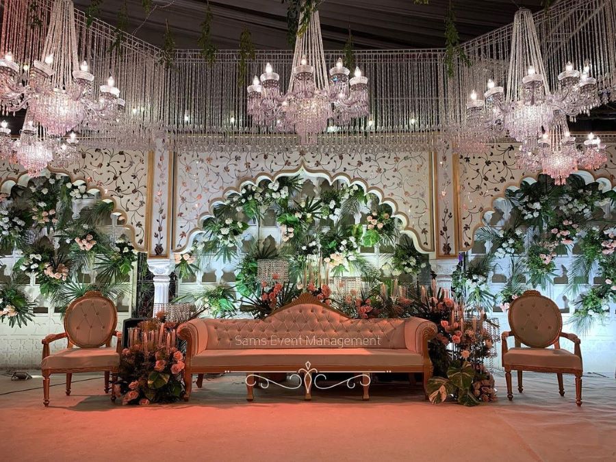 grand luxury wedding stage decoration ideas with chandeliers and crystals