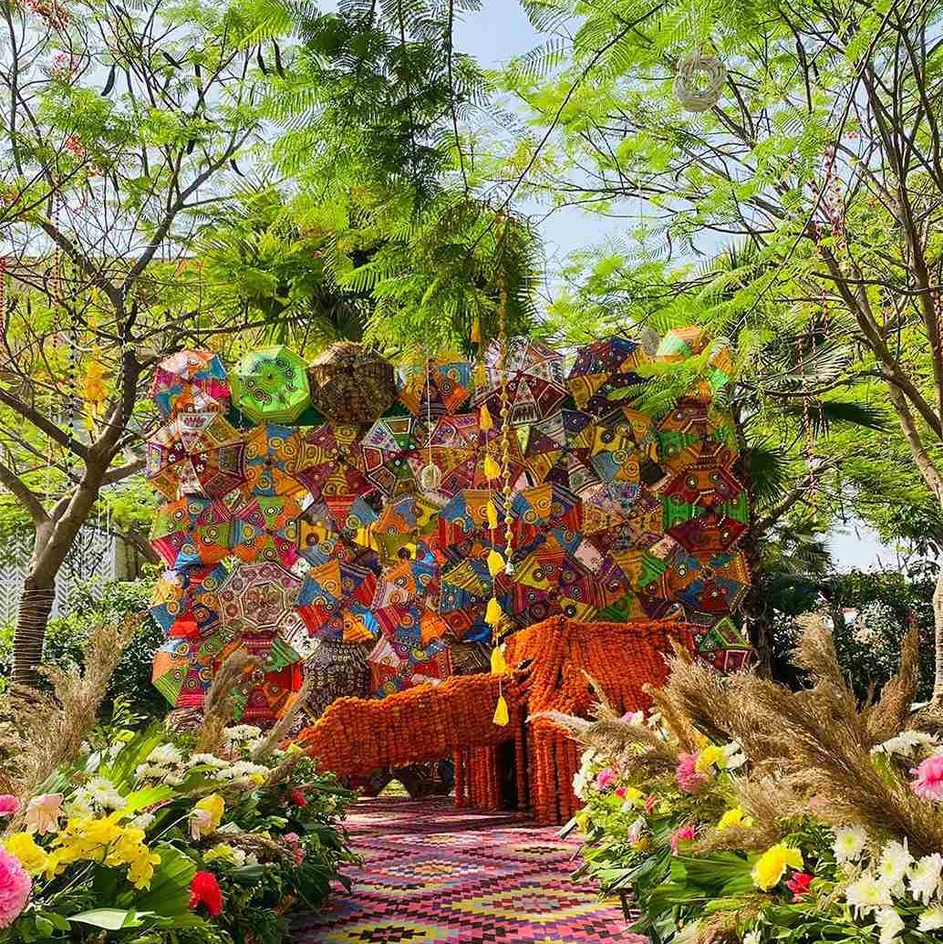 A radiant haldi decor with umbrellas