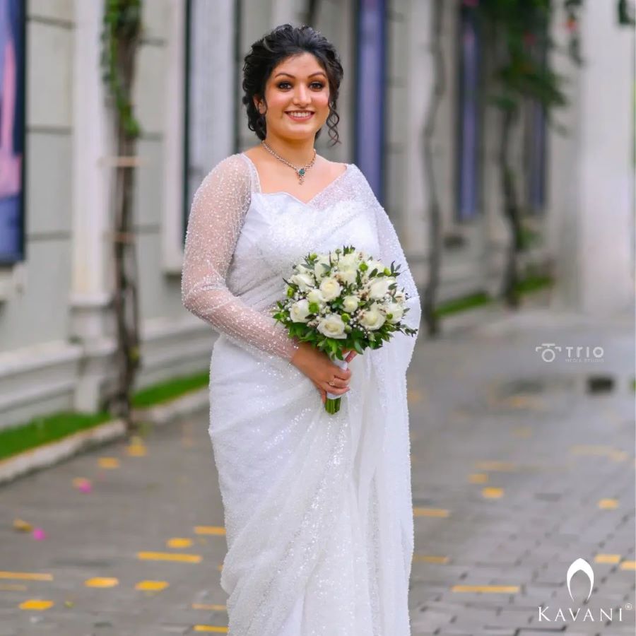 shimmery white saree with full sleeve blouse for christian bride