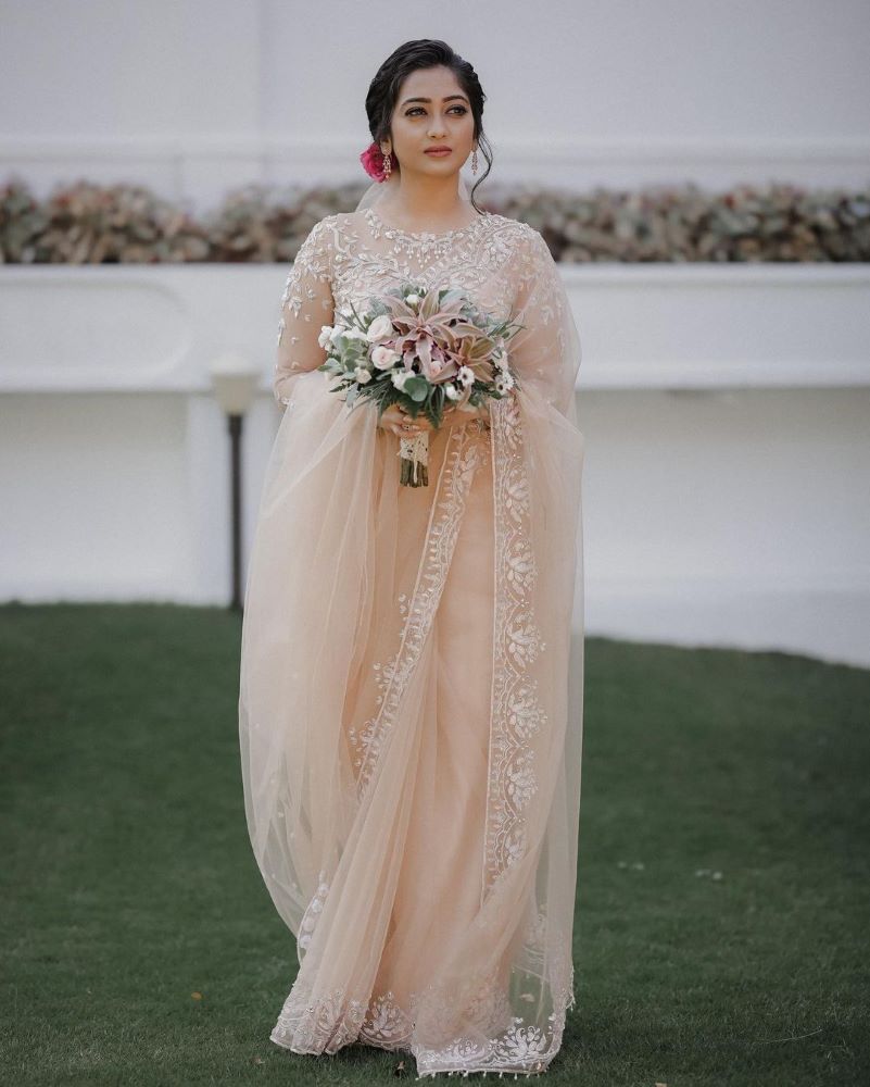 simple peach embroidered saree with veil for south indian christian bride