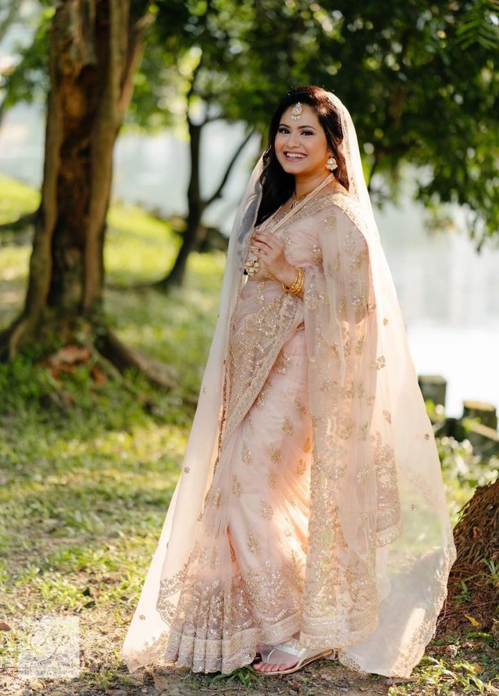 peach embroidered saree with veil for christian church wedding